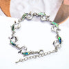 The Tropicana Nai'a Dolphin Bracelet - A beautiful silver dolphin bracelet adorned with crystals and polished paua shell.