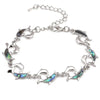 The Tropicana Nai'a Dolphin Bracelet - A beautiful silver dolphin bracelet adorned with crystals and polished paua shell.