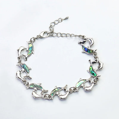 The Tropicana Nai'a Dolphin Bracelet - A beautiful silver dolphin bracelet adorned with crystals and polished paua shell.