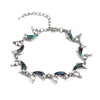 The Tropicana Nai'a Dolphin Bracelet - A beautiful silver dolphin bracelet adorned with crystals and polished paua shell.