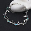 The Tropicana Nai'a Dolphin Bracelet - A beautiful silver dolphin bracelet adorned with crystals and polished paua shell.