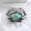 The Tropicana Papa'i Crab Brooch - A beautiful silver-toned zinc alloy crab brooch adorned with polished paua shell.