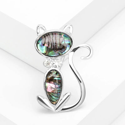 The Tropicana Popoki Cat Brooch - A stylised silver-toned zinc alloy cat brooch adorned with polished paua shell and artificial crystals.