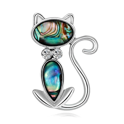 The Tropicana Popoki Cat Brooch - A stylised silver-toned zinc alloy cat brooch adorned with polished paua shell and artificial crystals.