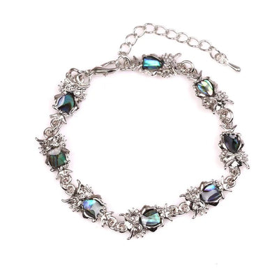 The Tropicana Pueo Owl Bracelet - A beautiful silver owl bracelet adorned with lovely polished paua shell.