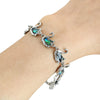 The Tropicana Ululani Swan Bracelet - A beautiful silver swan bracelet adorned with lovely polished paua shell.