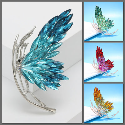 Tulia Oversized Butterfly Brooch - A huge crystal brooch featuring a side-view of a butterfly with a gradient of crystals making up its wings, available in blue, green, reddish pink, or yellow colour palettes.