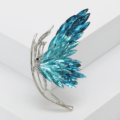 Tulia Oversized Butterfly Brooch - A huge crystal brooch featuring a side-view of a butterfly with a gradient of crystals making up its wings, available in blue, green, reddish pink, or yellow colour palettes.