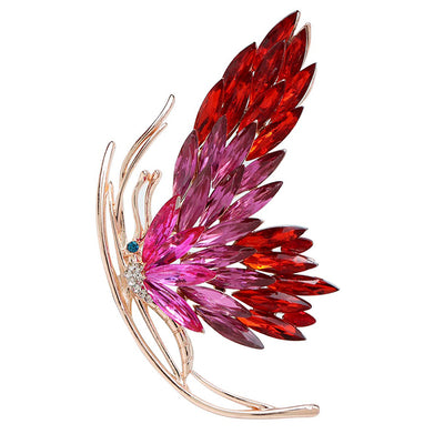 Tulia Oversized Butterfly Brooch - A huge crystal brooch featuring a side-view of a butterfly with a gradient of crystals making up its wings, available in green, reddish pink, or yellow colour palettes.