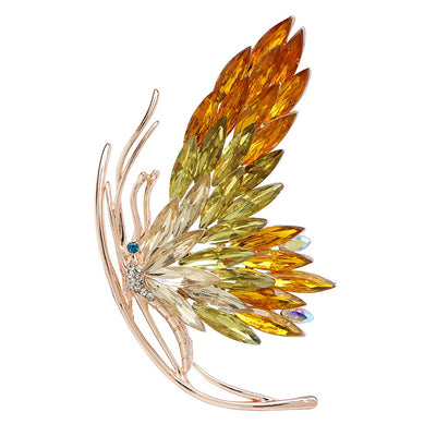 Tulia Oversized Butterfly Brooch - A huge crystal brooch featuring a side-view of a butterfly with a gradient of crystals making up its wings, available in green, reddish pink, or yellow colour palettes.