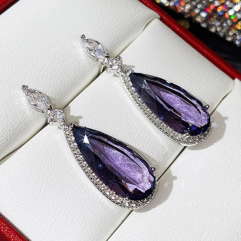 Verona Teardrop Crystal Drop Earrings - Elegant, classic drop earrings featuring a large purple central stone surrounded by tiny white quartz.