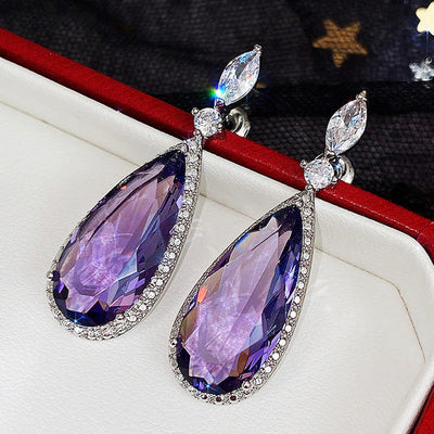 Verona Teardrop Crystal Drop Earrings - Elegant, classic drop earrings featuring a large purple central stone surrounded by tiny white quartz.
