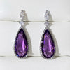 Verona Teardrop Crystal Drop Earrings - Elegant, classic drop earrings featuring a large purple central stone surrounded by tiny white quartz.