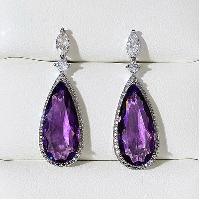 Verona Teardrop Crystal Drop Earrings - Elegant, classic drop earrings featuring a large purple central stone surrounded by tiny white quartz.