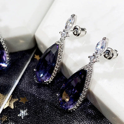 Verona Teardrop Crystal Drop Earrings - Elegant, classic drop earrings featuring a large purple central stone surrounded by tiny white quartz.