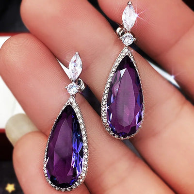 Verona Teardrop Crystal Drop Earrings - Elegant, classic drop earrings featuring a large purple central stone surrounded by tiny white quartz.