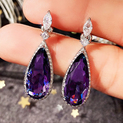 Verona Teardrop Crystal Drop Earrings - Elegant, classic drop earrings featuring a large purple central stone surrounded by tiny white quartz.