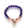 Violette Amethyst Stretch Bracelet - An elegant bracelet made from round purple and pink beads with a heart-shaped topaz as the centre piece.