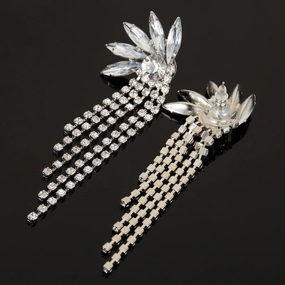 The Winona Luxury Crystal Earrings is the perfect start to your collection. They feature a large central crystal at the lobe with a starburst of medium crystals surrounding the main one, and five long trailers of smaller crystals to twinkle and dance around your shoulders as you move. Absolutely lovely!