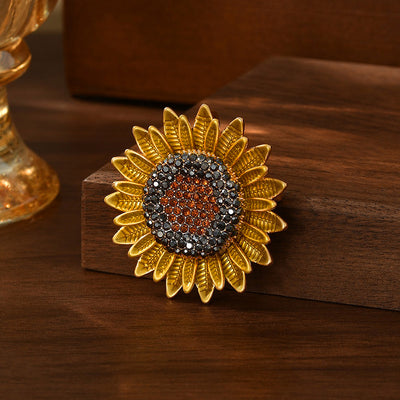 The Elidi Sunflower Brooch. This beautiful brooch is a simple, but elegant classical stylised sunflower, with glossy yellow petals, and sparkling crystals around the inside of the blossom.