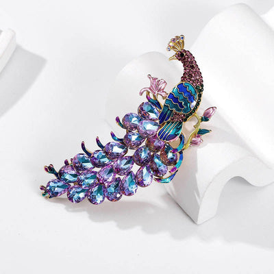 The Juno Crystal Peacock Brooch - A lovely stylized peacock brooch featuring glossy enamel paint and sparkling crystals.