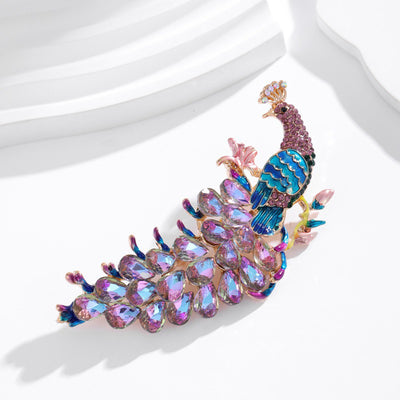 The Juno Crystal Peacock Brooch - A lovely stylized peacock brooch featuring glossy enamel paint and sparkling crystals.