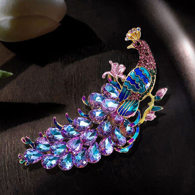 The Juno Crystal Peacock Brooch - A lovely stylized peacock brooch featuring glossy enamel paint and sparkling crystals.