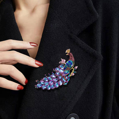 The Juno Crystal Peacock Brooch - A lovely stylized peacock brooch featuring glossy enamel paint and sparkling crystals.