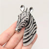 Majestic Zebra Oversized Brooch - An impressively large brooch crafted to look like the head and neck of a zebra in a relaxed pose.