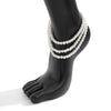 Marlene Pearl Anklet - A simple, elegant, vintage-style anklet featuring three strands of white artificial pearls attached to a lobster clasp at the back.