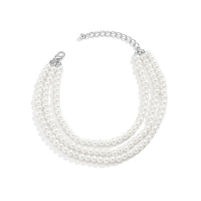 Marlene Pearl Anklet - A simple, elegant, vintage-style anklet featuring three strands of white artificial pearls attached to a lobster clasp at the back.