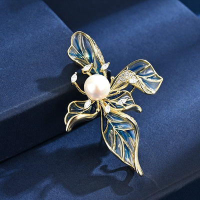 The Lorelei Lily Sculpted Resin Brooch - A lovely, long, elegant piece that features a five-petal lily clustered around a single pearl, with colourful resin to really make it pop and a dusting of crystal along the underside of the petals.