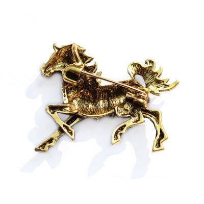 Zesty Zebra Brooch - A medium sized brooch shaped like a zebra running with its mane and tail flowing in the wind. It's available in gold or silver colours, and is studded with crystals.