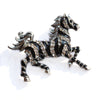 Zesty Zebra Brooch - A medium sized brooch shaped like a zebra running with its mane and tail flowing in the wind. It's available in gold or silver colours, and is studded with crystals.