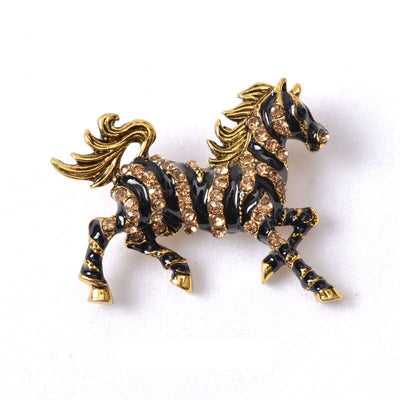 Zesty Zebra Brooch - A medium sized brooch shaped like a zebra running with its mane and tail flowing in the wind. It's available in gold or silver colours, and is studded with crystals.