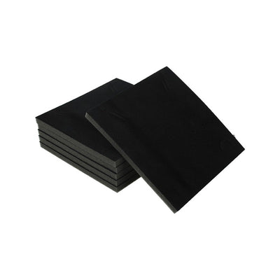 A stack of large sheets of velour flocked foam.
