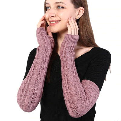The Snuggle Weather Arm Warmers - A pair of adorable knit over-elbow arm warmers available in nine snuggly winter colours: Blackout (black), Hot Chocolate (dark brown), Tempest (dark grey), Overcast (light grey), Gingerbread (light brown), Snowdrift (white), Mulberry (dark red), Rosé (dusky pink), and Vanilla (cream).