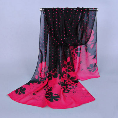 A lovely black and pink polkadot and flower scarf.