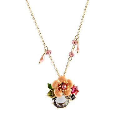 The Pretty Posy Enamel Necklace - A delicate floral pendant in an unusual shade of orange.