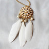 The Feathered Medallion - A long sweater chain adorned with feathers and faux pearls.