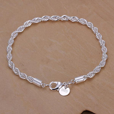 A bright silver spiral chain bracelet.
