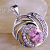 The Hypnotic Coil Pendant - A lovely delicate silver pendant with amethysts or pink topaz.