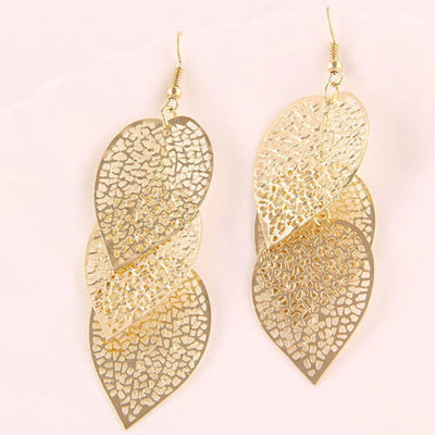 Large dangly leaf earrings available in gold or silver colours.
