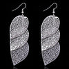 Large dangly leaf earrings available in gold or silver colours.