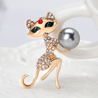 The Purrfect Ten Brooch - An adorable cat-themed brooch in gold and crystals.