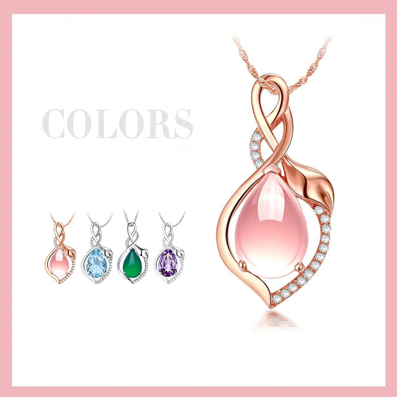 The Kore Necklace - A lovely delicate pendant studded with crystals, available in pink, blue, green, or purple. 