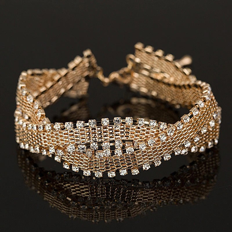 Gabrielle Luxury Crystal Bracelet - An elegant bracelet made of woven metals edged with clear crystals.