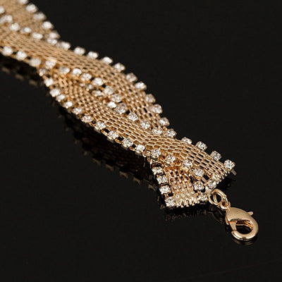Gabrielle Luxury Crystal Bracelet - An elegant bracelet made of woven metals edged with clear crystals.