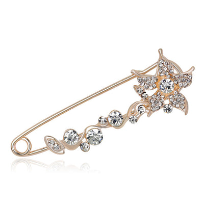 Scarf pins in assorted floral designs, rose gold colour with zircon crystals.