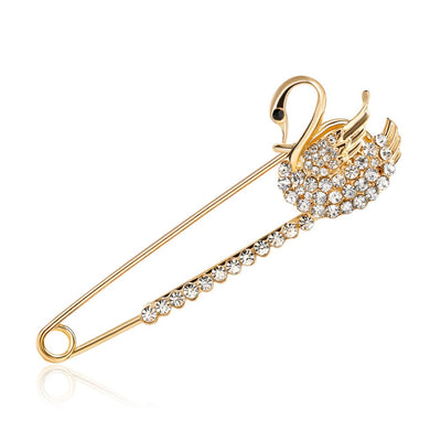 Scarf pins in assorted swan designs, gold colour with zircon crystals.